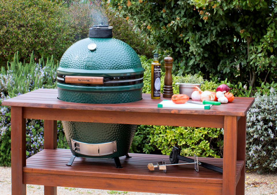 The Big Green Egg Medium is perfectly sized for smaller families and couples, and accommodates all the most popular EGGcessories, like the convEGGtor, Pizza & Baking Stone and the Arcadia hardwood table (shown here). Get all the famous Big Green Egg versatility and efficiency in a smaller package with plenty of cooking area to accommodate a backyard cookout of four steaks or two whole chickens.